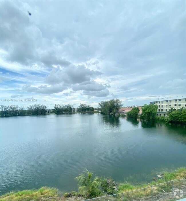 Building Photo - 9911 W Okeechobee Rd Unit 1-402 Rental