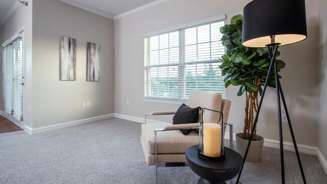 Unwind in open living rooms adorned with plush carpeting, multi-speed ceiling fans, and expansive windows, creating a soothing and comfortable environment beckoning you to snuggle up and relax.