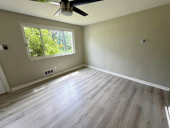 Photo - Comfortable 3-Bedroom Ranch with Yard, Garage & Bonus Basement Space