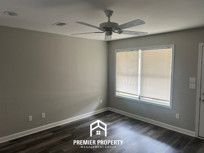 Photo - Spacious 4BR/2BA in Tuscaloosa | Hardwood Floors, 2-Car Garage & Covered Back Patio