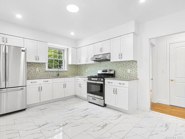 Photo - 65-44-65168 168th St Unit 1+2 FL