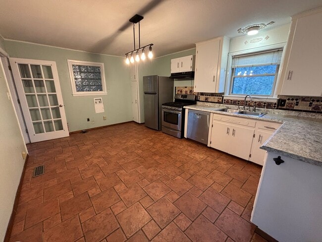 Photo - Welcome to this charming 3-bedroom, 2-bathroom home located in the desirable west side of Russell...