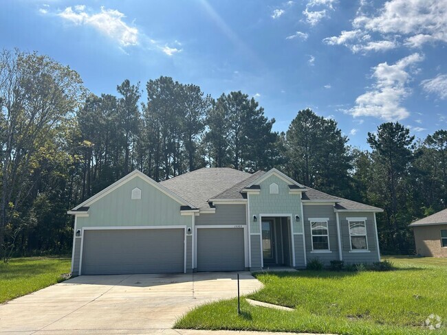 Building Photo - 4/3 + Bonus Room with 3 Car Garage on 1/2 ... Rental