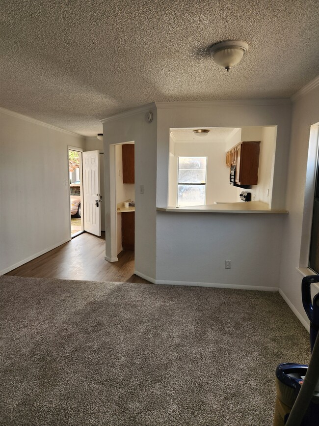 Entry and eat in Kitchen. Dishwasher, Range, Microwave, Washer dryer hookups, - 7408 Avenue X Apartments Unit 301