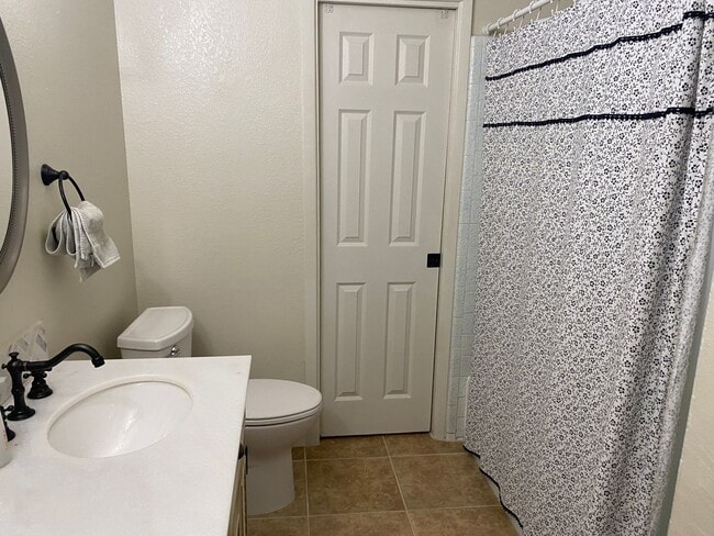 Photo - 3 bedroom home with large living room on a large corner lot with lots of room for play.