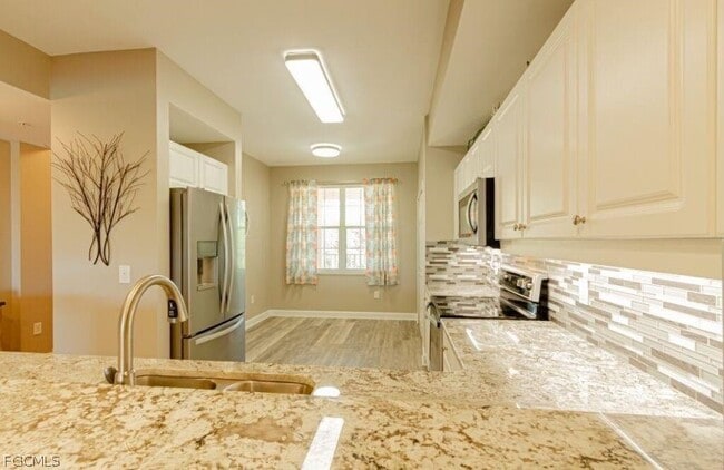 Building Photo - 10700 Ravenna Way Unit 303