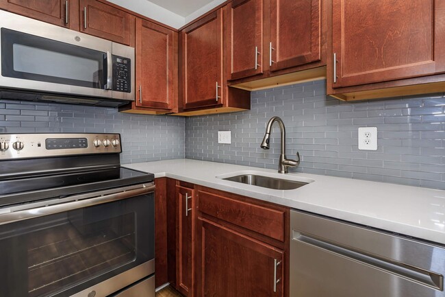 ALL-ELECTRIC KITCHEN - Whitestone at Landmark Apartments