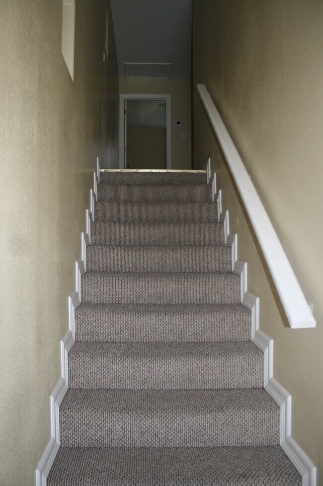 Carpeted stairway with recessed lighting - 1204 West Kiwi Unit apt B