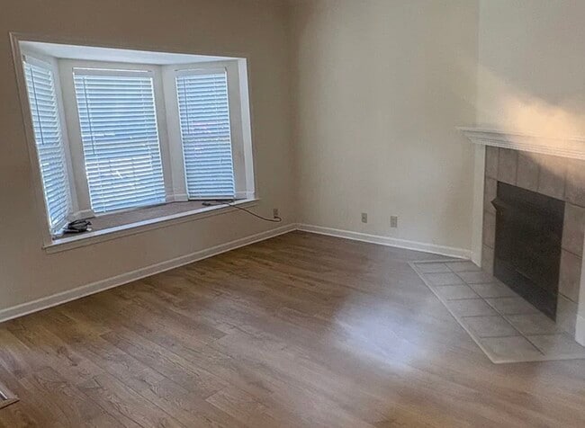 Bay window and fireplace in living room - 2121 Hwy 12 S Unit 138
