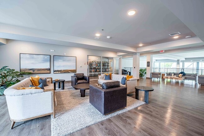 Step into the stylish lounge at Union Mill, featuring contemporary decor and spacious seating areas perfect for relaxation or gatherings. Enjoy natural light and a welcoming atmosphere that feels like home. Schedule your tour today!
