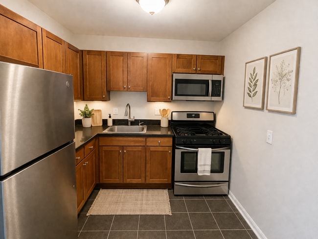 Building Photo - 2026 Move-In Special – $500 LEASE SIGNING BONUS!! Spacious 2BR Condo Near Naylor Rd Metro – Washe... Unit 301