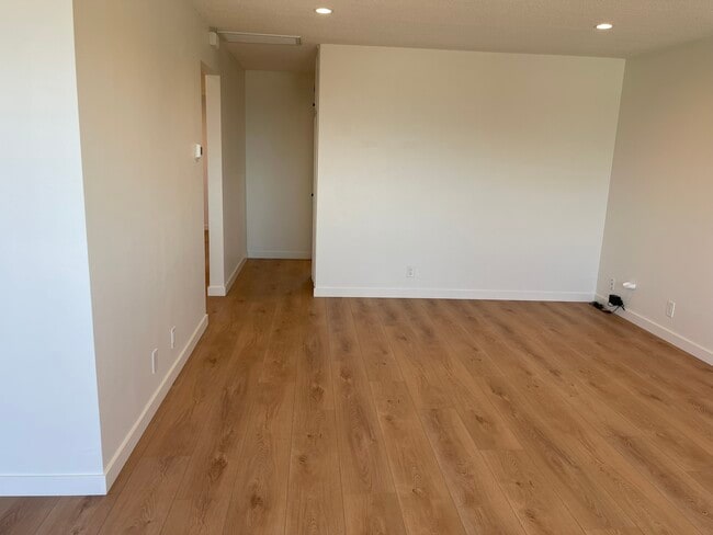 Living room looking towards hallway to bedroom. It looks bigger in person!! - 1039 6th St