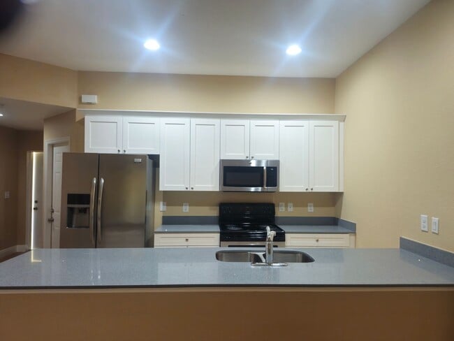 Photo - 3 Bedroom 2 Bath 1 Car Garage Duplex In a ...