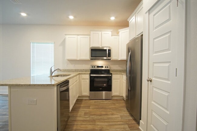 Photo - Spacious 3BR/2.5BA Townhome with 1-Car Garage in Admiral’s Quarters—Pool, Dog Park, Near 9 Mile R...