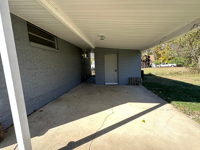 Covered porch & storage building - 6120 Pinedale Dr House