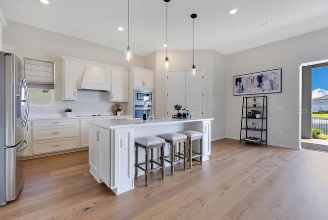 Photo - Waterfront Luxury in Isles of Lake Nona | 3-Car Garage, Resort Amenities & HOA-Included Cable, In...