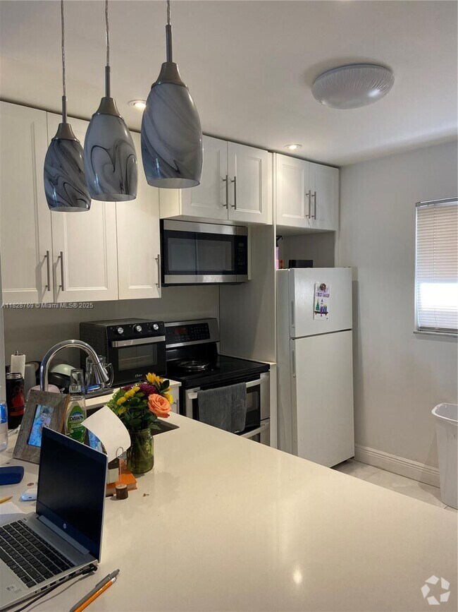 Building Photo - 7810 Camino Real Unit I-306 Rental