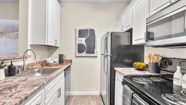 Embrace sleek, top-of-the-line appliances for refined culinary delights in your new home.