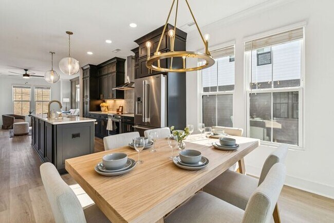 Photo - High-End 2BR Townhome | Rooftop Terrace + 2-Car Garage | 24-Unit Community