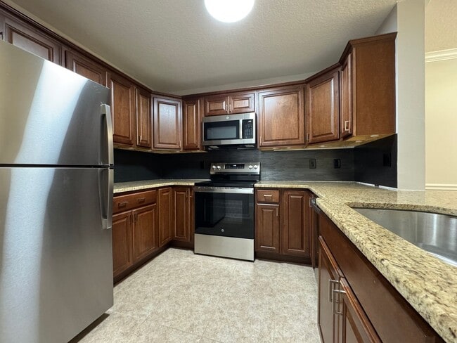 Photo - Oviedo 2/2 Condo with Tile & LVP Flooring, Updated Baths, New Paint & Appliances! Unit 104