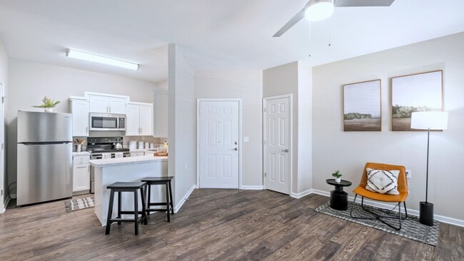 Embrace seamless living in our open floor plan, featuring a modern ceiling fan and contemporary design.