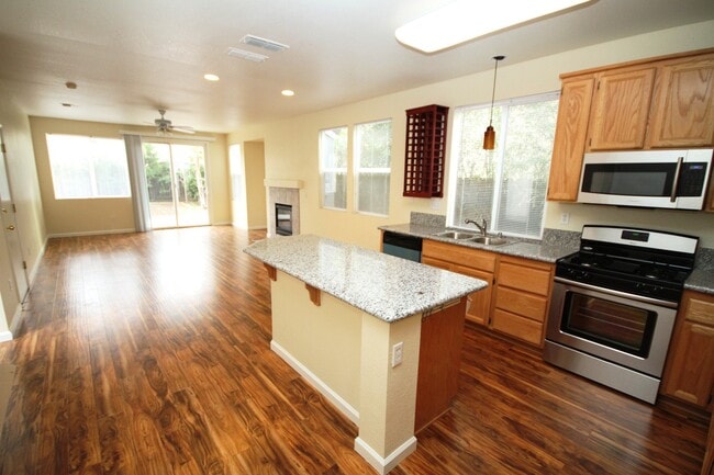 Photo - 4 Bed| 2.5 Bath | 2061 SF | 2 Car Garage | Long driveway with gate | Tenant pays $175 monthly for...