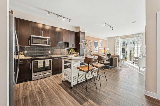 Modern kitchen with sleek finishes. - The Heights at Goose Creek Village Rental