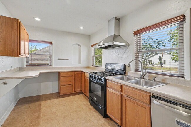 Photo - Spacious 4-Bedroom, 2-Bath Home with Large Yard, Garage & Central A/C
