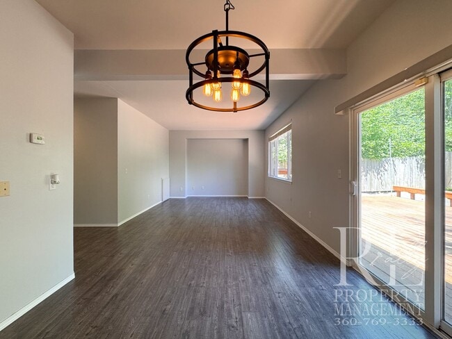 Photo - Dual Primary Suites, Huge Backyard Deck & Sun-Filled Living Spaces Near Everyday Conveniences