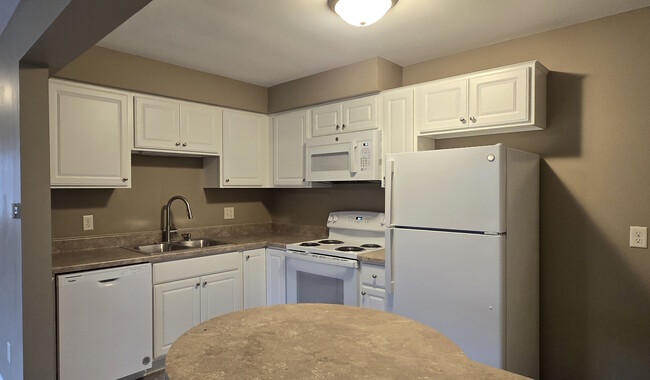 Updated Kitchen - 30 Maple St NE Apartments