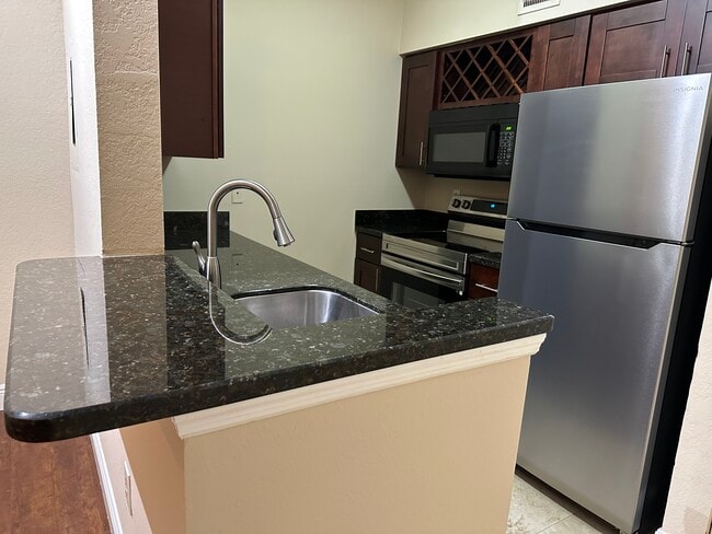 Building Photo - 2850 N Oakland Forest Dr Unit 208