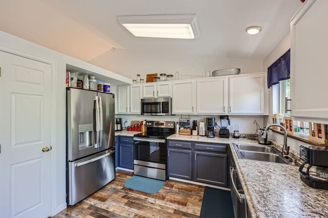 Photo - Evolve Real Estate: Fantastic Home with Large Yard Available for Move in on August 2nd