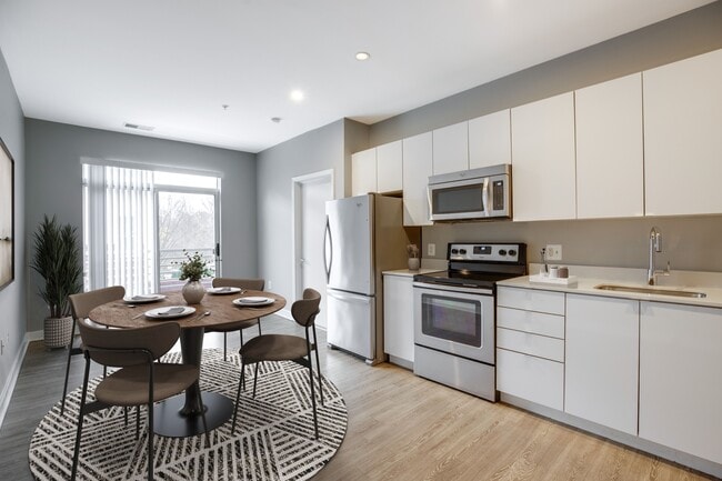 Kitchen and living area (virtually staged)
