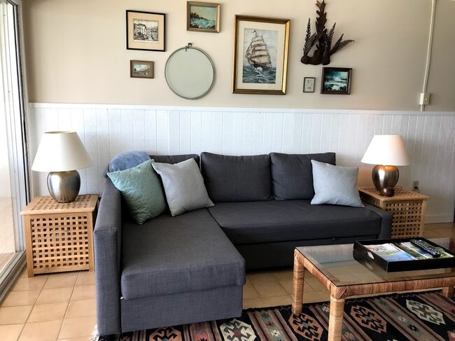 Living room with vintage nautical decor - 19450 Gulf Blvd Unit #702