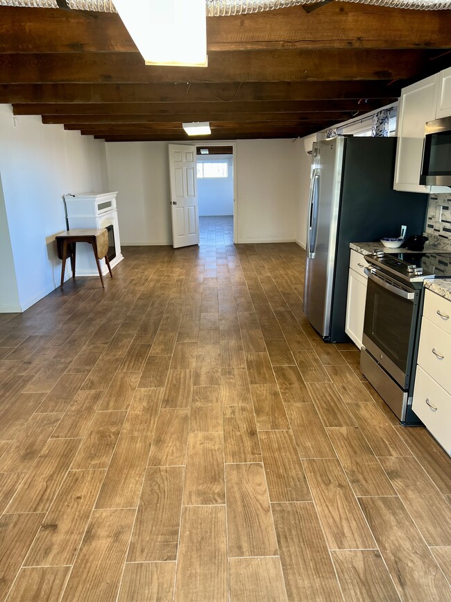 View of kitchen and living room - 8442 McCrory Ln Unit 1