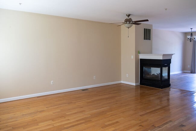 3 sided fireplace between living and dining areas - 23312 Brewers Tavern Way