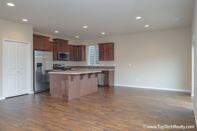 Photo - Spacious 4-Bedroom + Office Home in Abbey Creek – Modern Finishes, EV Charger & Low-Maintenance B...