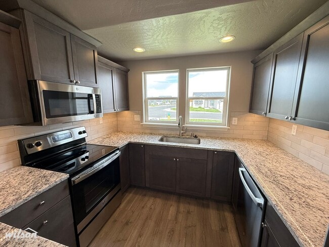 Photo - 3bd/2ba House in West Valley with Central AC, Fully Fenced Yard and Two Car Garage!