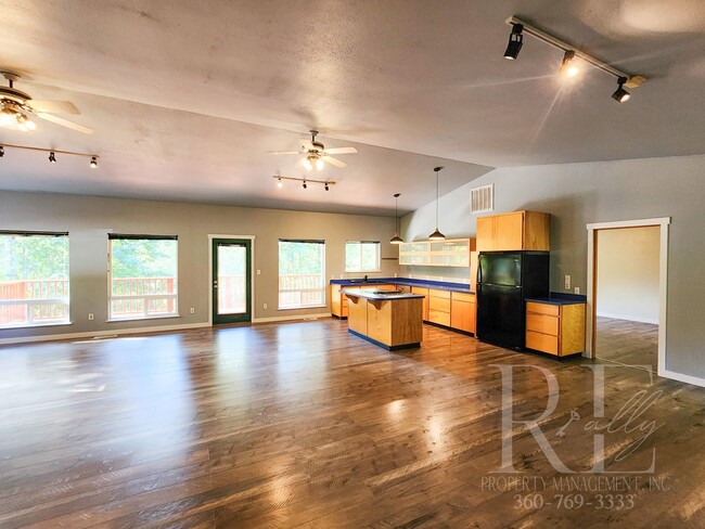 Photo - Vaulted Ceilings, Unique Designer Kitchen & Expansive Half-Acre Setting with Flexible Living Spaces