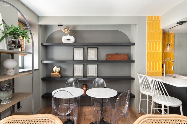 Dining Area - hidden projector screen above shelving - 2440 16th St NW Unit 104