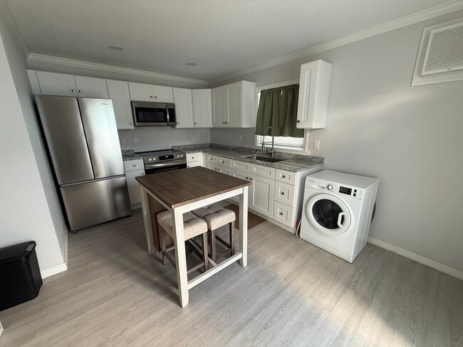 Kitchen with washer/dyer combo - 324 Clearwater Ave