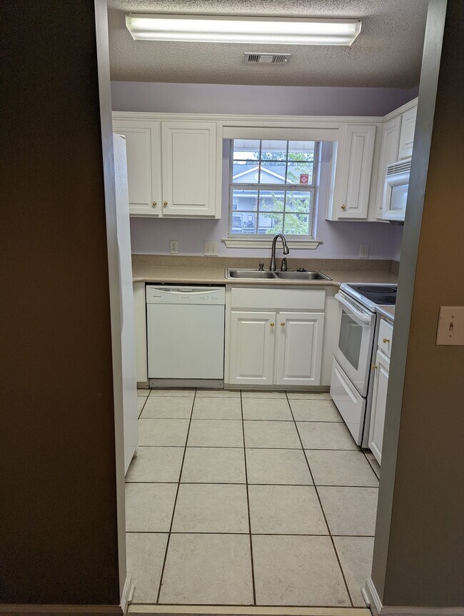 Kitchen with dishwasher and full suite of appliances included - 76 Al Henderson Blvd Unit B1