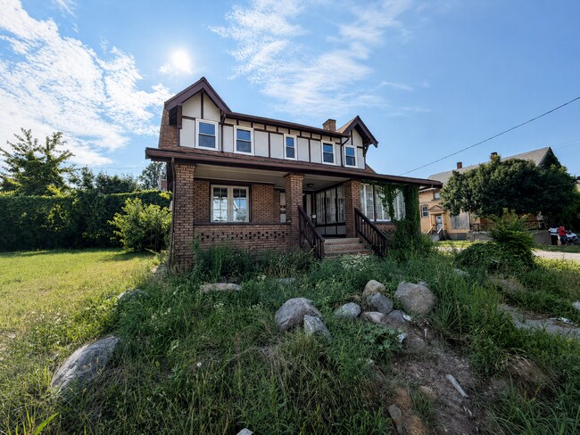 Photo - Four bedrooms. A sunroom. A fenced yard. A garage. Your next home is ready to be discovered!