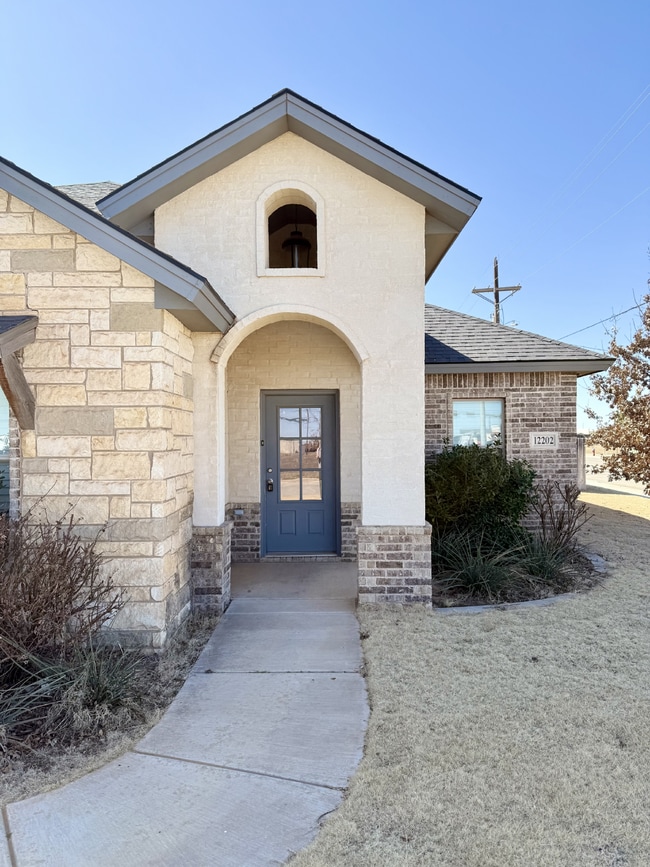 Photo - South Lubbock Home with Open Layout, Fireplace & Covered Patio