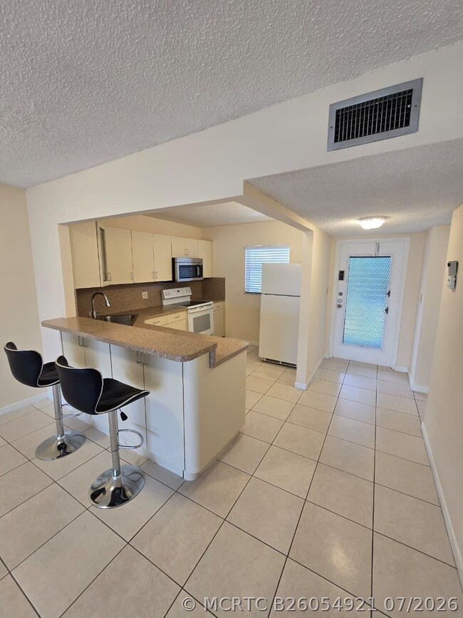 Building Photo - 8321 Sands Point Blvd Unit D306