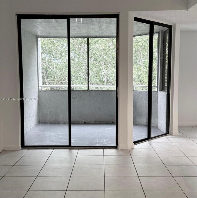 Building Photo - 8275 SW 152nd Ave Unit D408