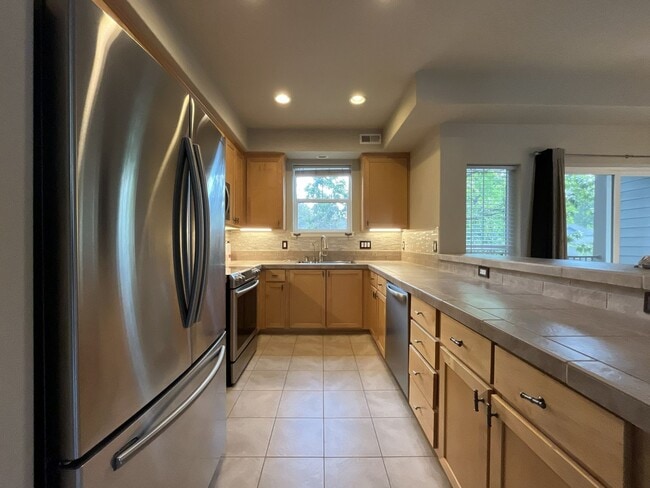Photo - Distinctive 3-Story Tigard Townhouse with Stainless Steel Kitchen, Vaulted Ceilings & Attached 2-...