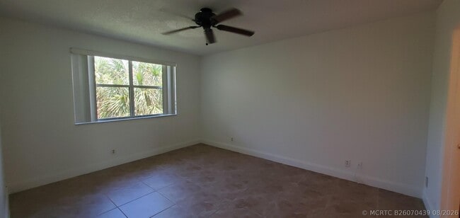 Building Photo - 8721 Wiles Rd Unit 302