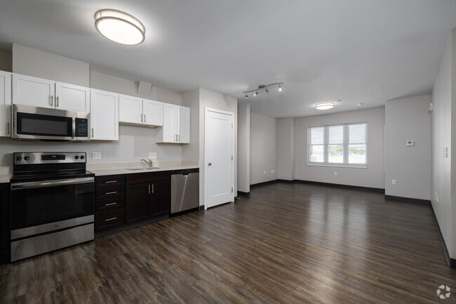 2BR, 1.5BA - 890SF - Kitchen and Living Room