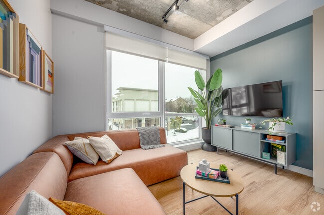 3BR, 2BA - 773SF - Living Room - Hub Bloomington